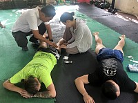 Students learn hands-on sports massage at athletic gyms.