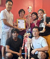 International massage practitioners from France, USA, India, China, Oman.